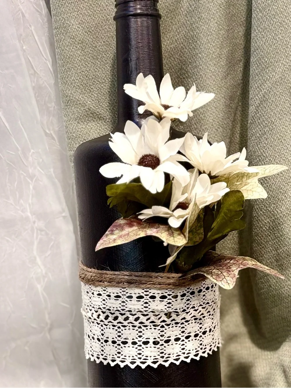 Handcrafted Black Bottle Vase with White Daisies and Lace Accent